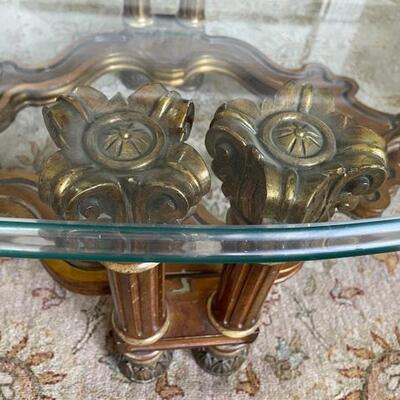 Sold. Oval glass top coffee table column detail