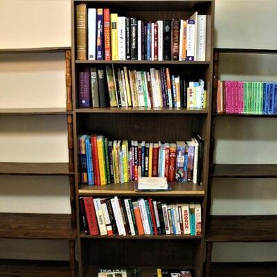 Wooden storage, book case and books (each sold separately). 