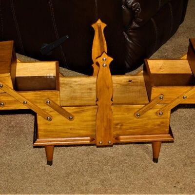 A very unique wood folding storage cabinet.