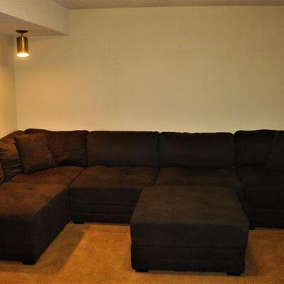 Large sectional couch with oversized ottoman.