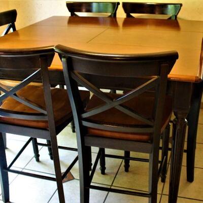 Ultra cool, contemporary dining set with six chairs.  With leaves table measures 54