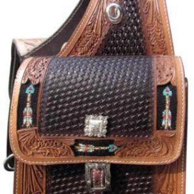 67	

Showman Â® Basketweave and leaf tooled leather saddle bag.
This saddle bag features dark leather basket weave tooled center with...