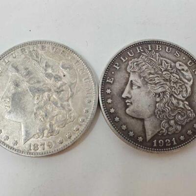 #1881 â€¢ One 1879 E. Pluribus Unum Coin And One 1921 E. Pluribus Unum One Dollar Coin

