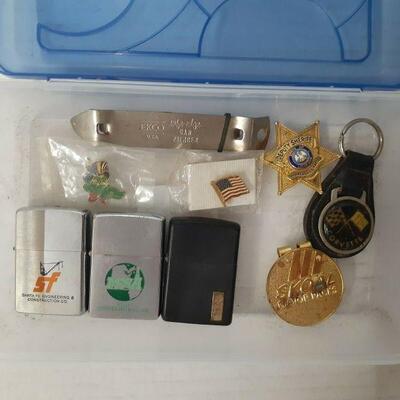 https://www.ebay.com/itm/124840402127	DS8006 : Box Lot Lighters, Pins, and other misc. items 
