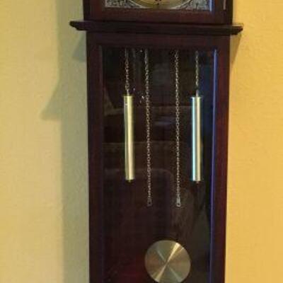 31 Day Grandmother clock. Measures 71in tall x 14-1/2in wide x 8in deep.