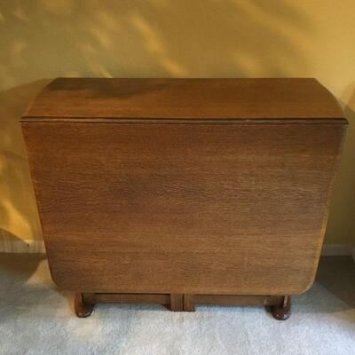 Antique Drop Leaf Table with storage underneath. Table as shown measures 35-1/2in x 15in x 29in tall.  Table fully extended measures...