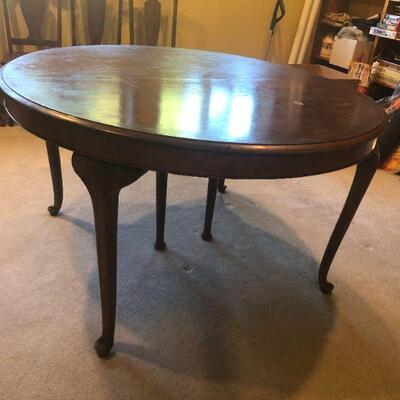 Round Walnut Table with Cabriole Legs. Table top needs restoration. Otherwise this is a nice solid table. Measures 54in diameter x...