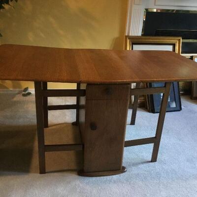Drop Leaf Table extended measures 61-1/2in long x 35-1/2 in at widest point x 29in tall.