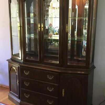 2 Piece Ethan Allen Lighted China Cabinet. The Cabinet as shown measures 80in tall x 60in wide x 17in deep.