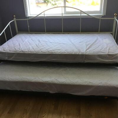 Daybed has two twin mattresses.