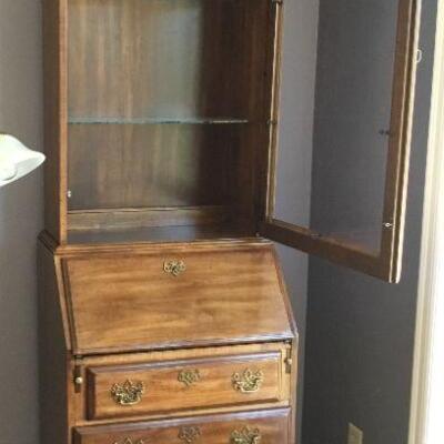 Secretary Desk has top hutch with two glass shelves.