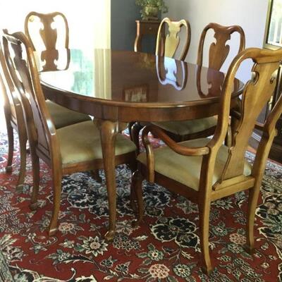 Dining Table, 6 Chairs and 2 Leaves. (Leaves are not pictured). Dining Table without leaves measures 67in x 44in x 30-1/2 in tall. 