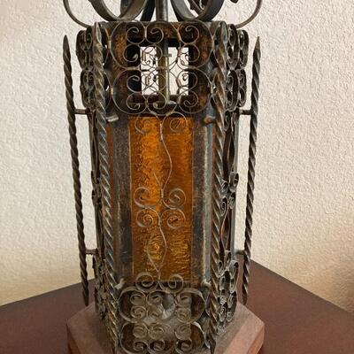 Vintage ornate forged iron and colored glass table lamp.
