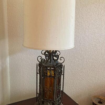 Vintage ornate forged iron and colored glass table lamp.