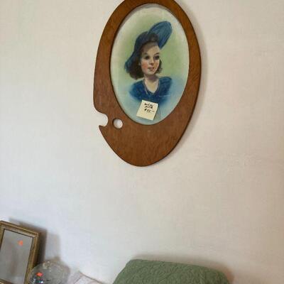 signed painting in an artist's palette frame