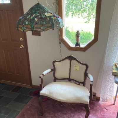 dragonfly hanging lamp and either a wide chair or a small settee