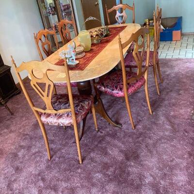 marble top on Duncan Phyfe base dining table and six chairs