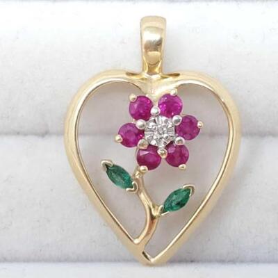 1238	

14k Gold Rubies, Diamonds And Emeralds Pendant , 3.1g
Weighs Approx 3.1g