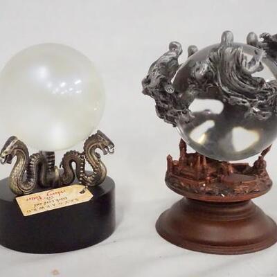 1101	LOT OF TWO HARRY POTTER CRYSTAL BALL REPLICAS. LOT INCLUDES DEMENTORS CRYSTAL BALL HAS DAMAGE ON BASE, & PROCHECY ORB. 
