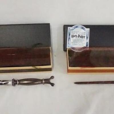 1106	LOT OF TWO HARRY POTTER THE NOBLE COLLECTION WAND REPLICAS, LOT INCLUDES; PROFESSOR SLUGHORN & FENRIR GREYWOLF, W/ ORIGINAL BOXES. 
