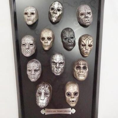 1088	HARRY POTTER THE NOBLE COLLECTION DEATH EATER MASK COLLECTION ON PLAQUE. 16 1/4 IN X 12 IN . 
