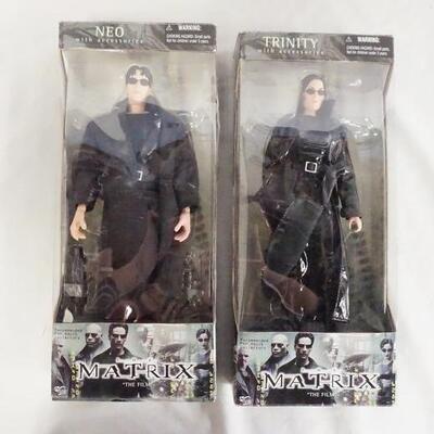1169	LOT OF TWO THE MATRIX DOLLS W/ ORIGINAL BOXES BY N2 TOYS. LOT INCLUDES NEO & TRINITY 
