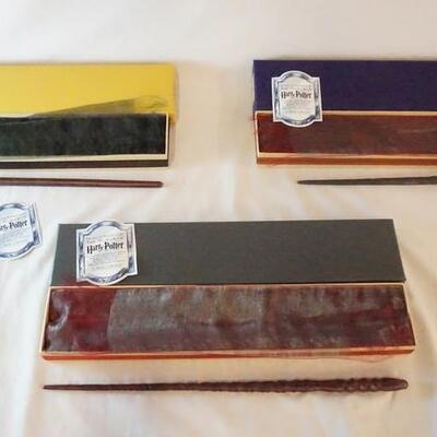 1042	LOT OF THREE HARRY POTTER THE NOBLE COLLECTION WAND REPLICAS, LOT INCLUDES DRACO MALFOR, CHO CHANG, & MAD-EYE MOODY REPLICAS W/...