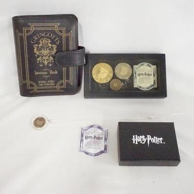 1075	LOT OF HARRY POTTER GRINGOTTS BANK COLLECTABLES, LOT INCLUDES A NECKLACE BACK OF PENDANT IS MARKED STERLING SILVER, 3 COINS IN...