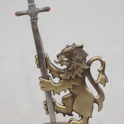 1098	HARRY POTTER THE NOBLE COLLECTION SWORD LETTER OPENER W/ GRYFFINDOR STAND.  APP. 9 1/4 IN H INCLUDING LETTER OPENER. 
