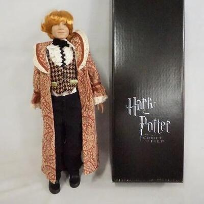 1117	HARRY POTTER TONNER DOLL RON WEASLEY AT THE YULE BALL, 17 IN H COMES W/ STAND, BASE, WAND, & ORIGINAL BOX. 
