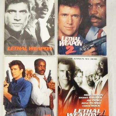 1007	LOT OF FOUR LETHAL WEAPON MOVIE PRESS KITS FOR THE 1ST, 2ND, 3RD, & 4TH INSTALLMENTS. KITS CONTAIN STILLS FROM THE FILMS, PRODUCTION...