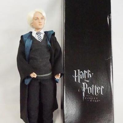 1119	HARRY POTTER TONNER DOLL DRACO MALFOY AT HOGWARTS, COMES W/ STAND, BASE, WAND & ORIGINAL BOX. 17 IN H 
