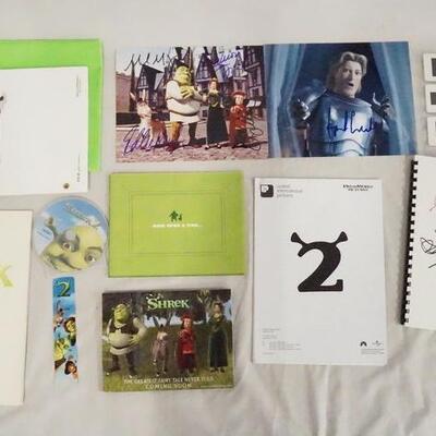 1140	LOT OF MOVIE MEMORABILIA FROM THE FIRST & SECOND SHREK FILMS. LOT INCLUDES A SIGNED SCRIPT & 2 SIGNED PRINTS, A DIGITAL PRESS KIT,...