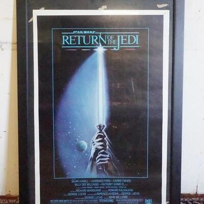 1160	STAR WARS 1983 RETURN OF THE JEDI FRAMED MOVIE POSTER. POSTER ALONE IS 22 IN X 34 IN.  FRAME IS 27 IN X 39 IN. 
