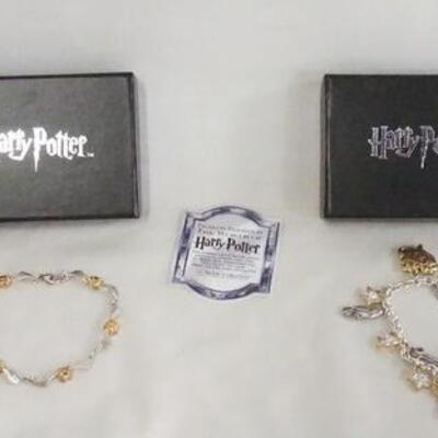 1085	LOT OF TWO THE NOBLE COLLECTION HARRY POTTER STERLING SILVER BRACLETS. ONLY THE CHAIN IS MARKED STERLING ON CHARM BRACELET. BOTH...