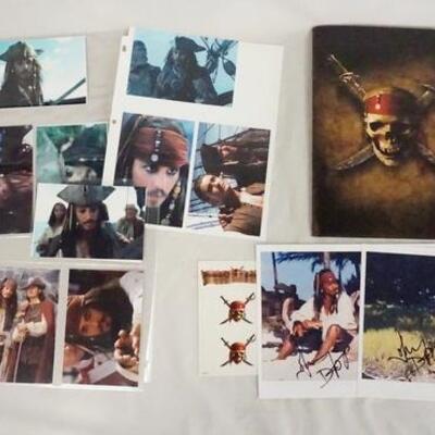 1028	LOT OF PIRATES OF THE CARRIBEAN MOVIE MEMORBILIA. LOT INCLUDES TWO PRESS KITS FOR THE CURSE OF THE BLACK PEARL, SIGNED PRINTS ETC. 
