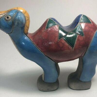 https://www.ebay.com/itm/124835396055	ME7006 South African Raku Pottery Camel Figurine (blue and yellow head)
