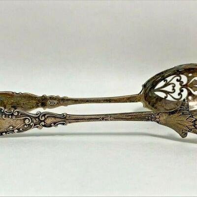 https://www.ebay.com/itm/114918154937	ME1028 STERLING SILVER ORNATE TONGS WITH E.H. INITIALS AND BIRD FOOT 
