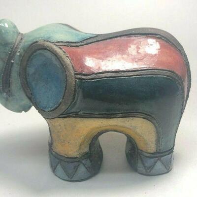https://www.ebay.com/itm/124835396041	ME7003 South African Raku Pottery Elephant Figurine (light green head)
