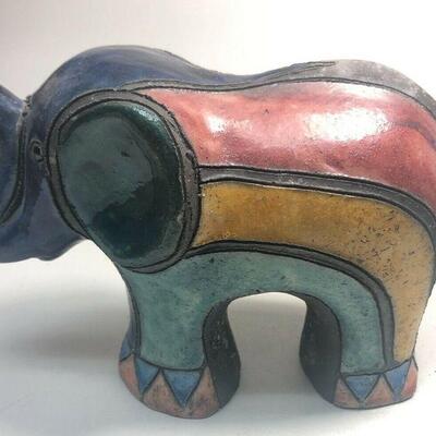 https://www.ebay.com/itm/114918154978	ME7010 South African Raku Pottery Elephant Figurine (dark blue head) (Large)
