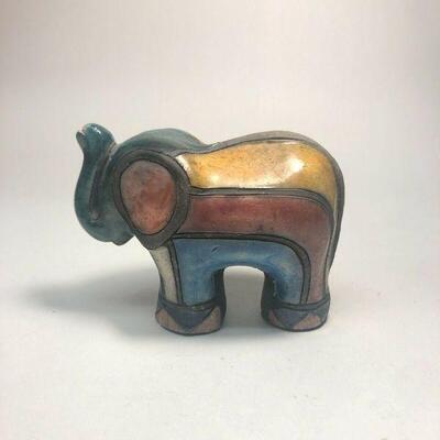 https://www.ebay.com/itm/114918154935	ME7002 South African Raku Pottery Elephant Figurine (dark green head)
