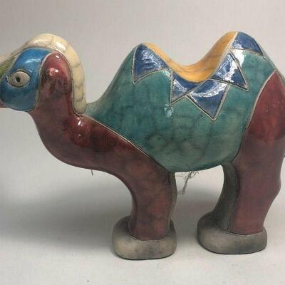 https://www.ebay.com/itm/114918154997	ME7007 South African Raku Pottery Camel Figurine (white, red, and blue head
