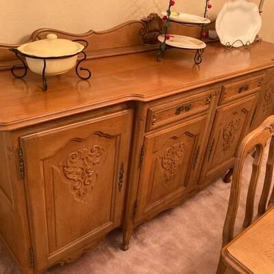 Traditional French Provincial break front sideboard/buffet. (oak) Matching table, chairs and china cabinet. Made in Belgium.  Key...