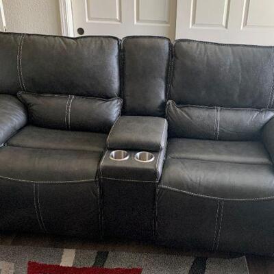beautiful leather power reclining loveseat...1 yr old