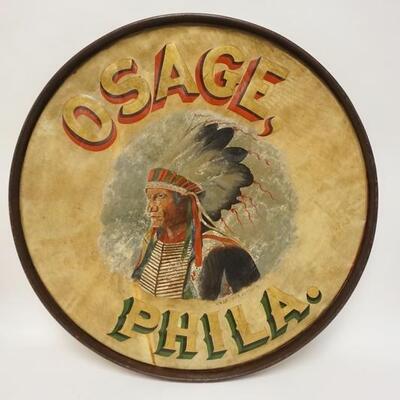1052	HAND PAINTED BASE DRUM HEAD W/NATIVE AMERICAN IN FULL HEADRESS, *OSAGE, PHILA*, ARTIST SIGNED *H.W. GREINER 285TH 3D DT*, 32 1/2 IN...