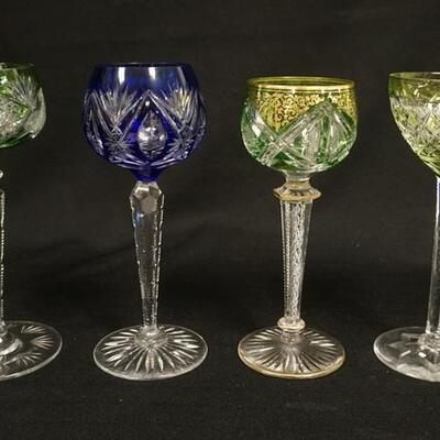 1095	4 COLOR CUT TO CLEAR GOBLETS, ALL HAVE CUT STEMS & FEET, ONE HAS GOLD ENAMELING & AN AIR TWIST STEM
