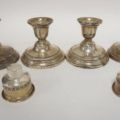 1222	4 WEIGHTED STERLING SILVER CANDLESTICKS, ALL HAVE TWISTS & DENTS, LOT INCLUDES 2 INSERTS THAT WEIGHT 0.93 TOZ
