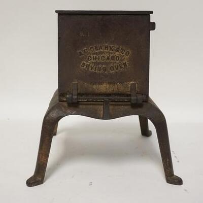 1267	CAST IRON DRYING OVEN. A.C. CLARKE & CO.  CHICAGO, FOR DRYING DENTURES BASE IS 7 1/2 IN SQUARE, 8 1/2 IN H 
