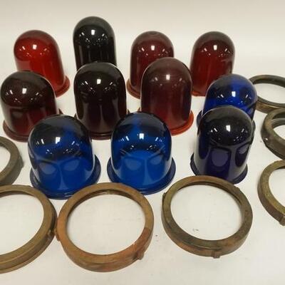1271	11 COLORED GLASS DOME SHADES, 7 RED, 4 BLUE, 2 ARE CHIPPED HAVE 7 METAL MOUNTING RIMS TALLEST IS 6 1/4 IN 
