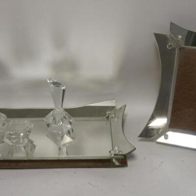 1278	MIRRORED DRESSER SET TRAY, PICTURE FRAME, 2 CRYSTAL PERFUMES & A POWDER TRAY 26 IN X 14 IN . PERFUMES ARE 7 1/4 IN H

